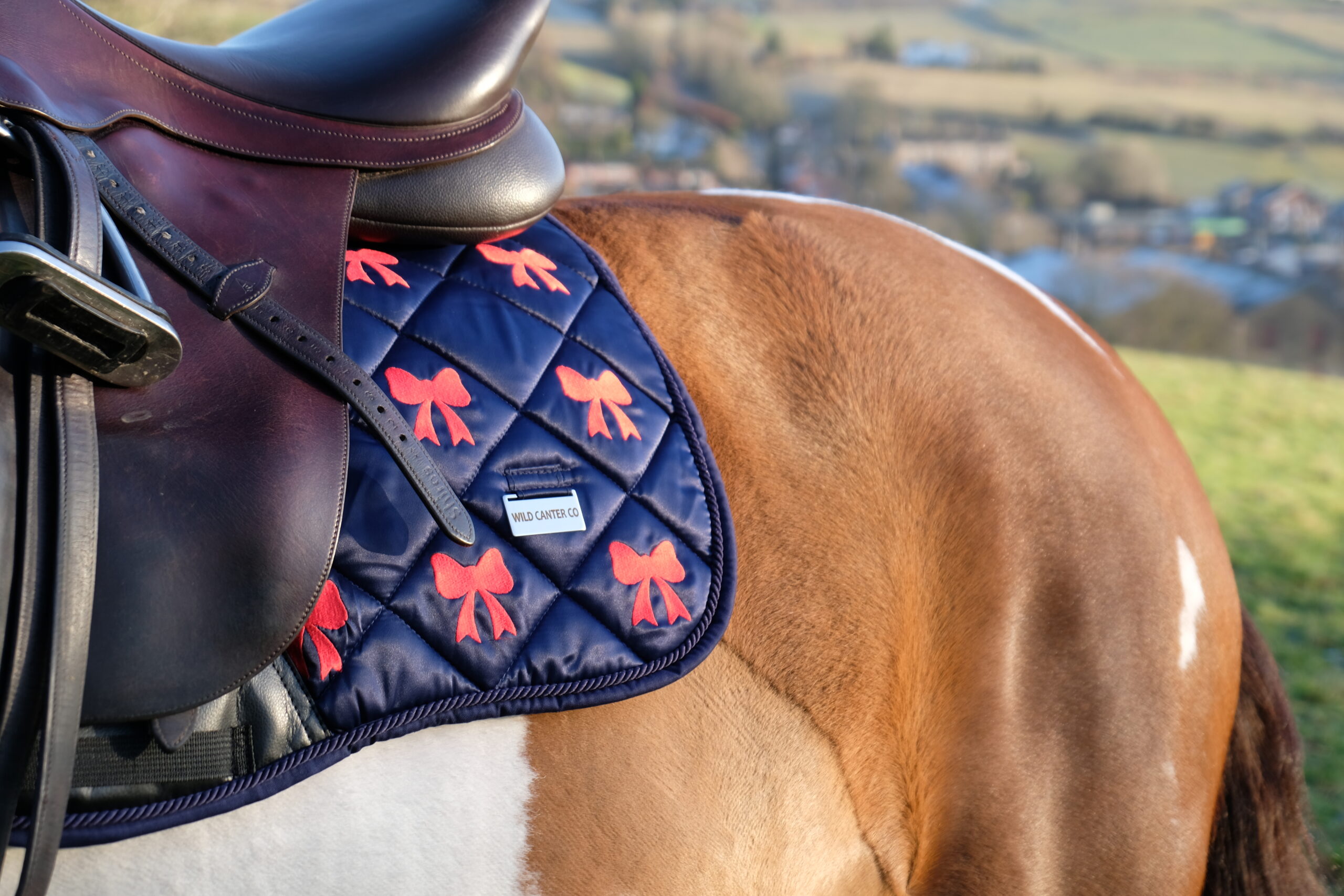Élan Rouge Luxury Satin Dressage Saddle Pad – Embroidered Bow Design